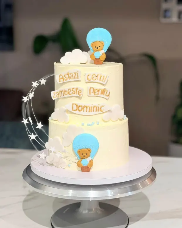 Christening cake with name, teddy and balloons