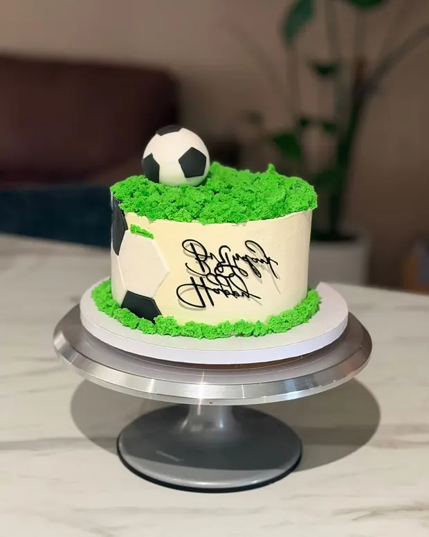 Football cake with a grass border