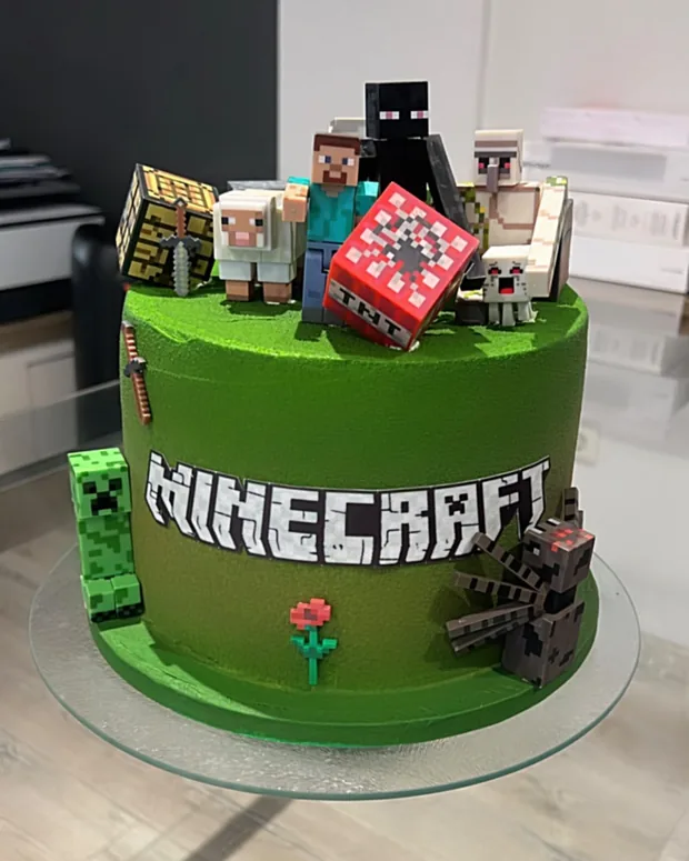 Green cake with block figures