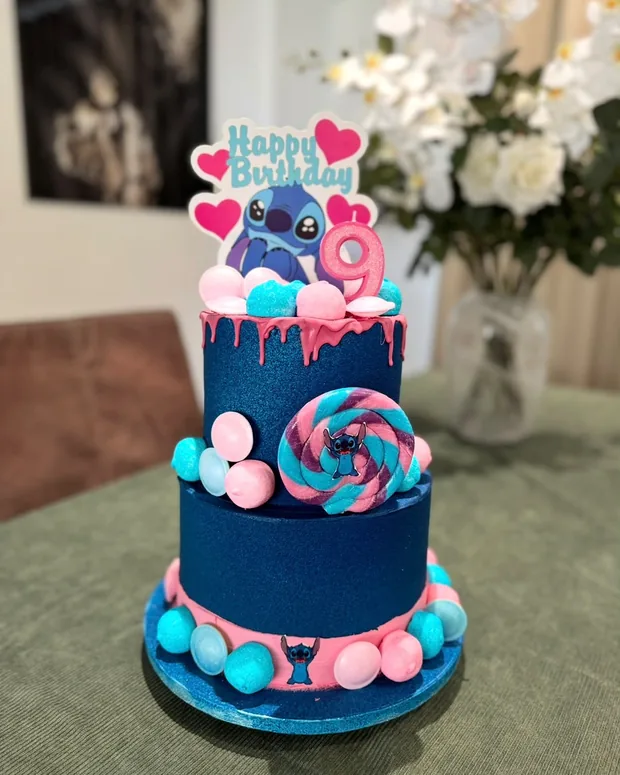 Blue and pink, with a lollipop and figures