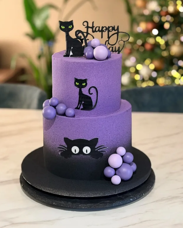 Purple cake with black cats