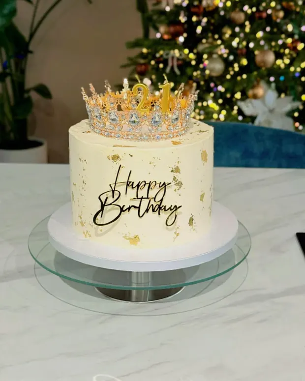 Ivory cake with a golden crown