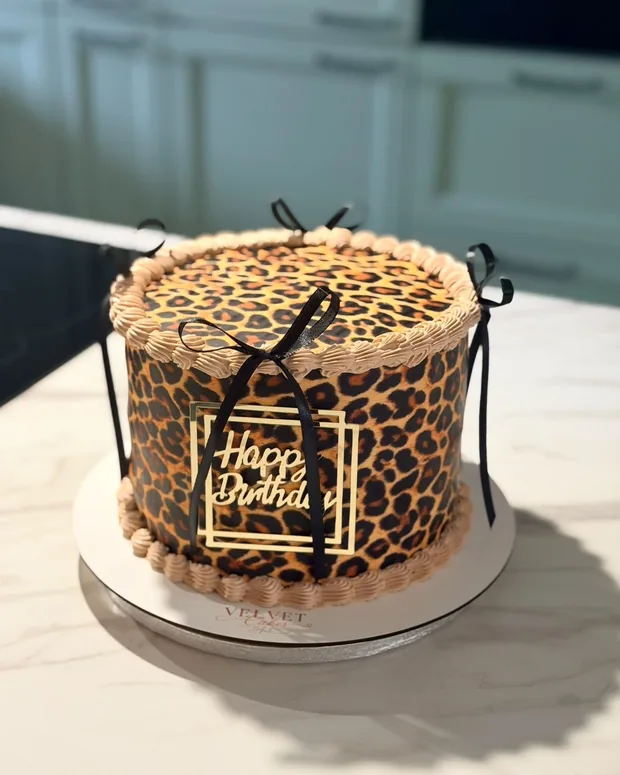 Leopard print with a black bow