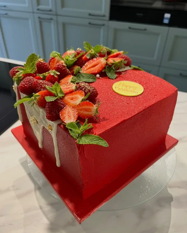Square red cake with strawberries