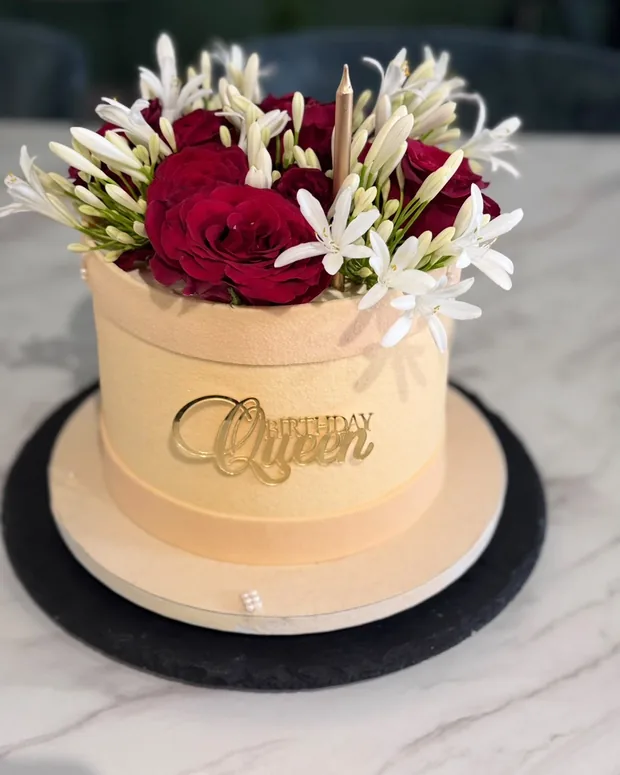 Ivory with red roses and white blossom