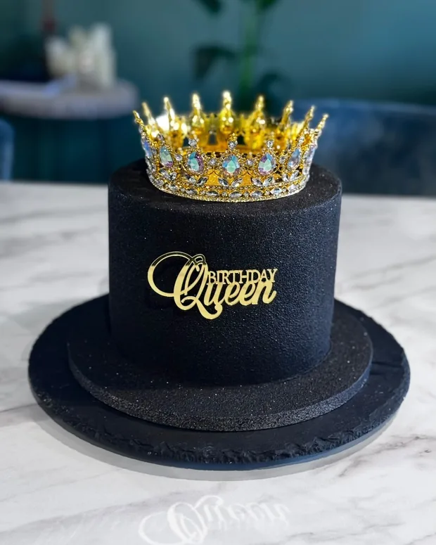 Black cake with a golden crown